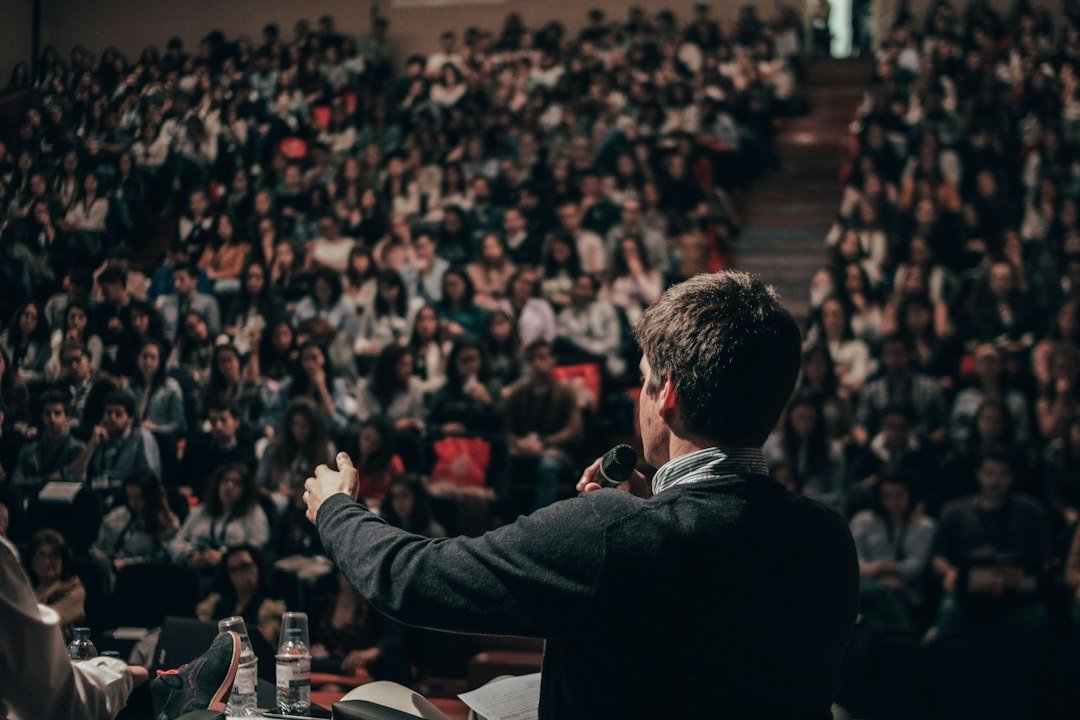 Speaker addressing a full conference hall