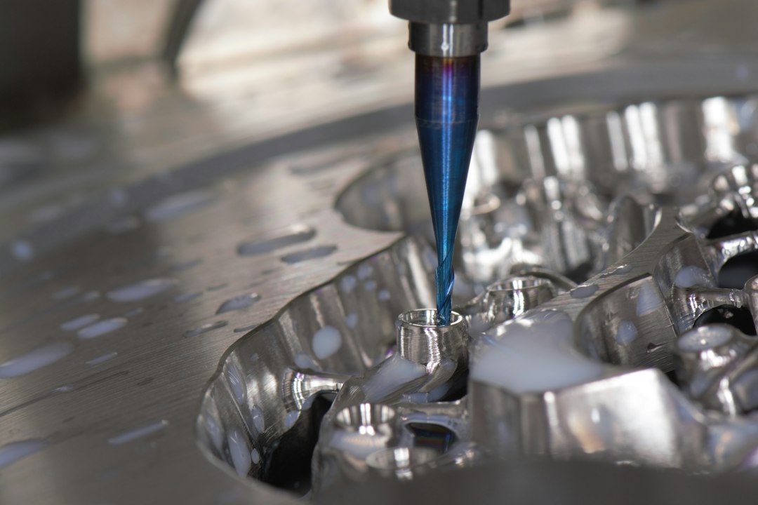 Milling spindle cutting a restoration from a blank